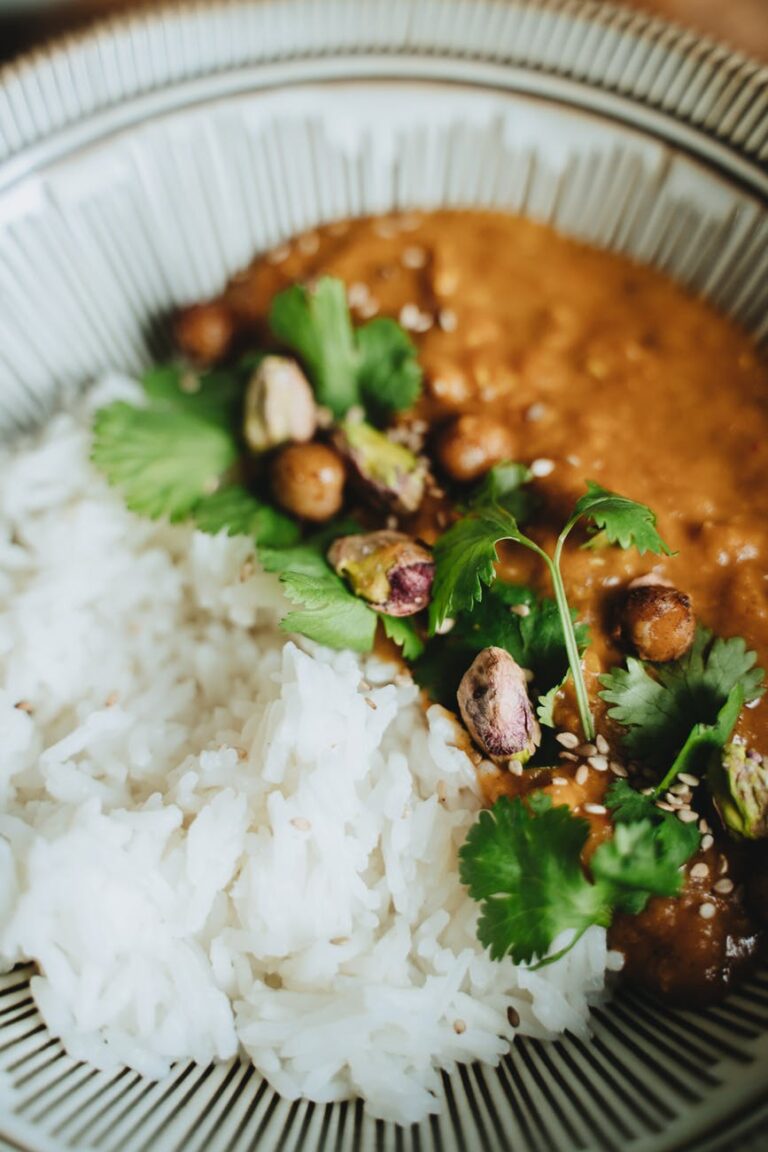 Rice cooked in coconut milk served with lentils and cilantro